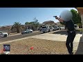 Bodycam Video Shows Police Shootout with Alleged Carjacking Suspect