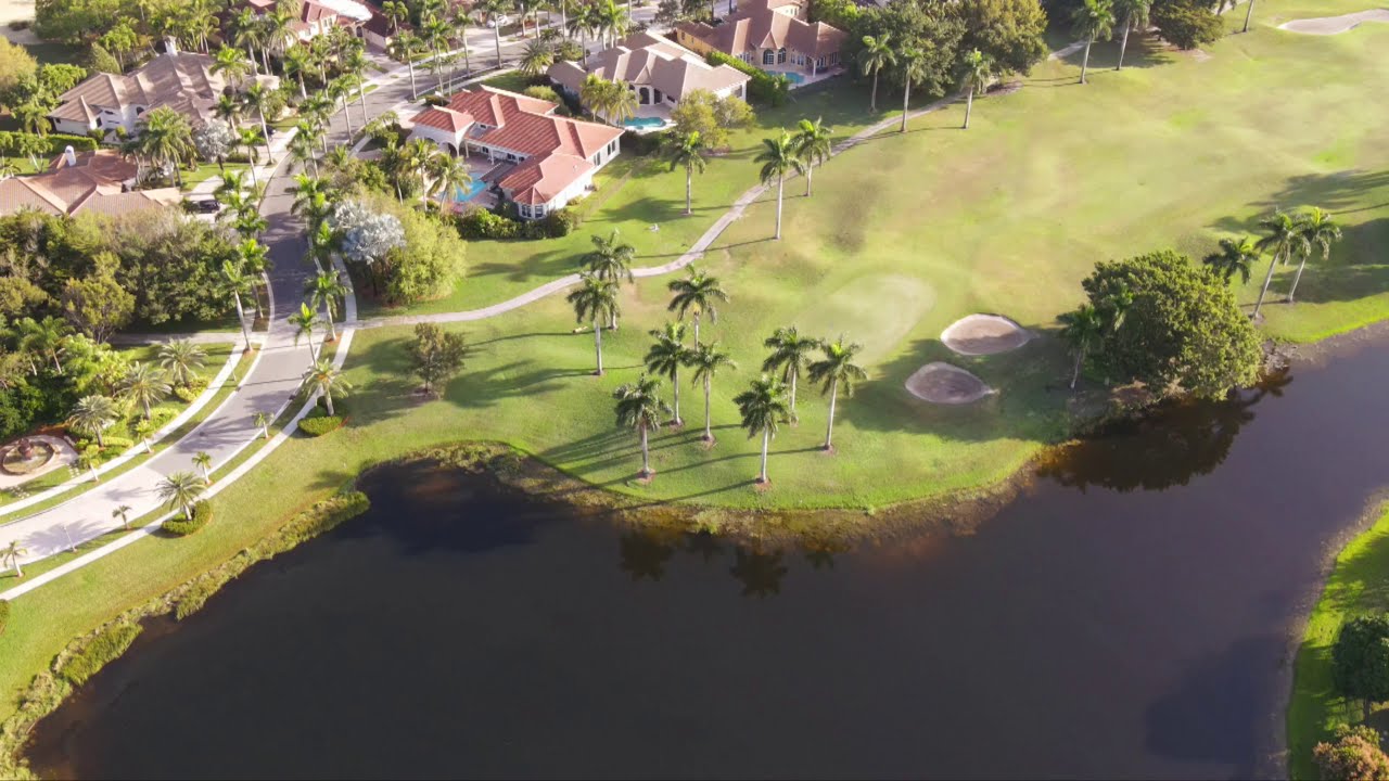 Weston Hills Country Club. Circular with homes, lake and golf course.