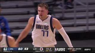 Luka Doncic hits a crazy Step-back 3 pointer and now has 21 points at halftime...