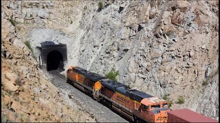 Small gang of railfans watch BNSF freight disappear into Mullan Pass tunnel - June 2022