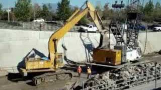 CAT 245D performing an unusual task