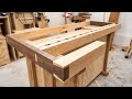 The woodworkers workbench  hand cut dovetails dog holes and a vise