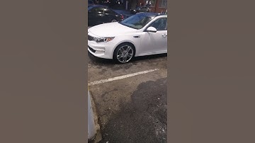 This white kia got some beautiful and shiny rims on it