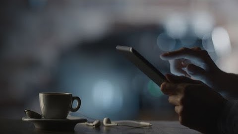 Man Using Tablet PC in Cafe | Stock Footage - Videohive