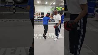 Floyd Mayweather Sr. works out with a guest to the Mayweather Boxing Club