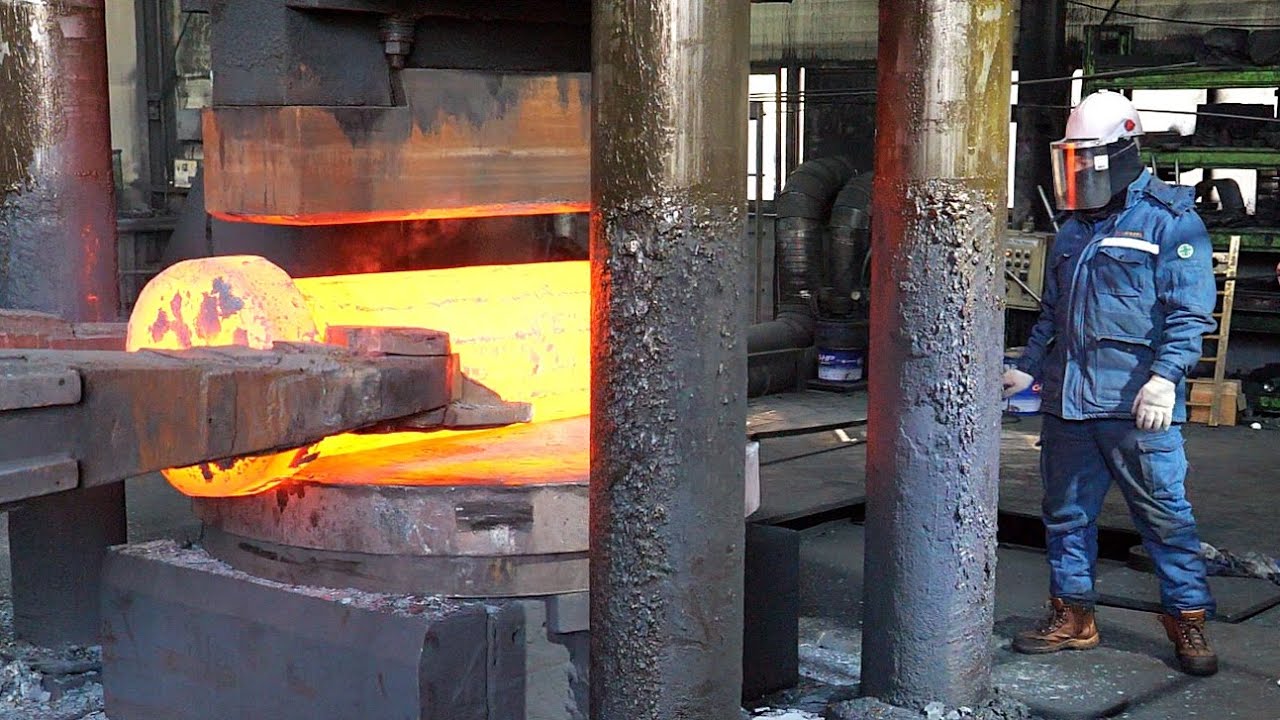 Process of Making Large Shafts for Wind Turbines. Giant Heavy Metal Forging Factory.