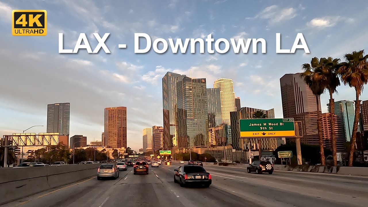 Из аэропорта Лос-Анджелеса в центр города: автострады, пальмы, горизонт, городская атмосфера.