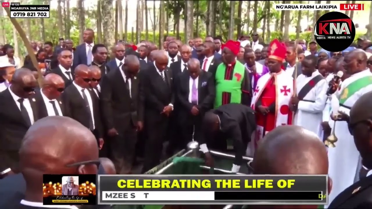EX MUNGIKI LEADER MAINA NJENGA AND HIS FAMILY MEMBERS GIVING LAST RESPECT AT HIS FATHER'S GRAVE