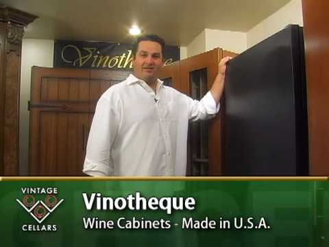 Jake shows off the features of the elegant Vinotheque Chateau Montelena Wine Cabinet in the Vintage Cellars showroom.