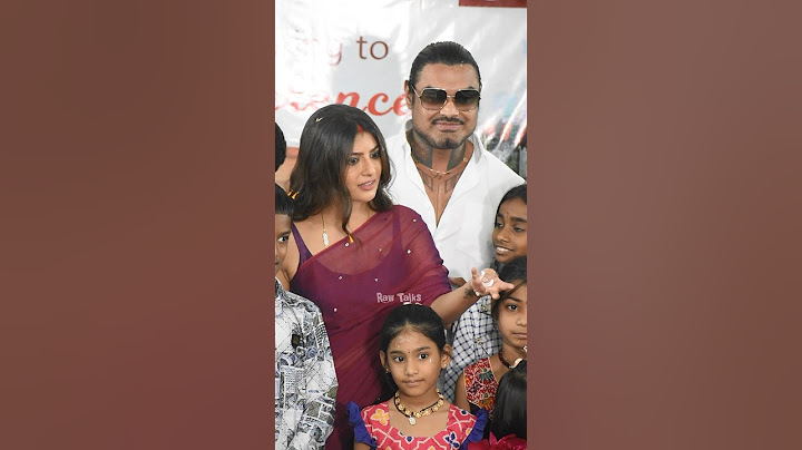 Varalakshmi with husband nicholai sachdev at orphanage home