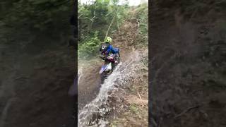 Hitting Steep Bank On A Dirt Bike