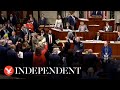 Representatives celebrate and wave flags after us congress passes ukraine aid package