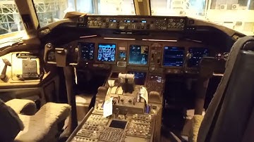 Boeing 777 primary flight computer software loading and location of PFCs in MEC and cargo area.