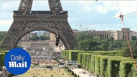 Daring thrill-seekers zip-line off the Eiffel Tower at 90 km/hr! - Daily Mail