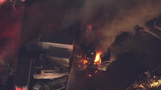 Crews work to contain flames at West Sacramento tow yard