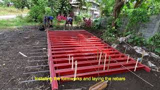 Perimeter fencing using precast concrete post, cyclone wire, and barbed wire.