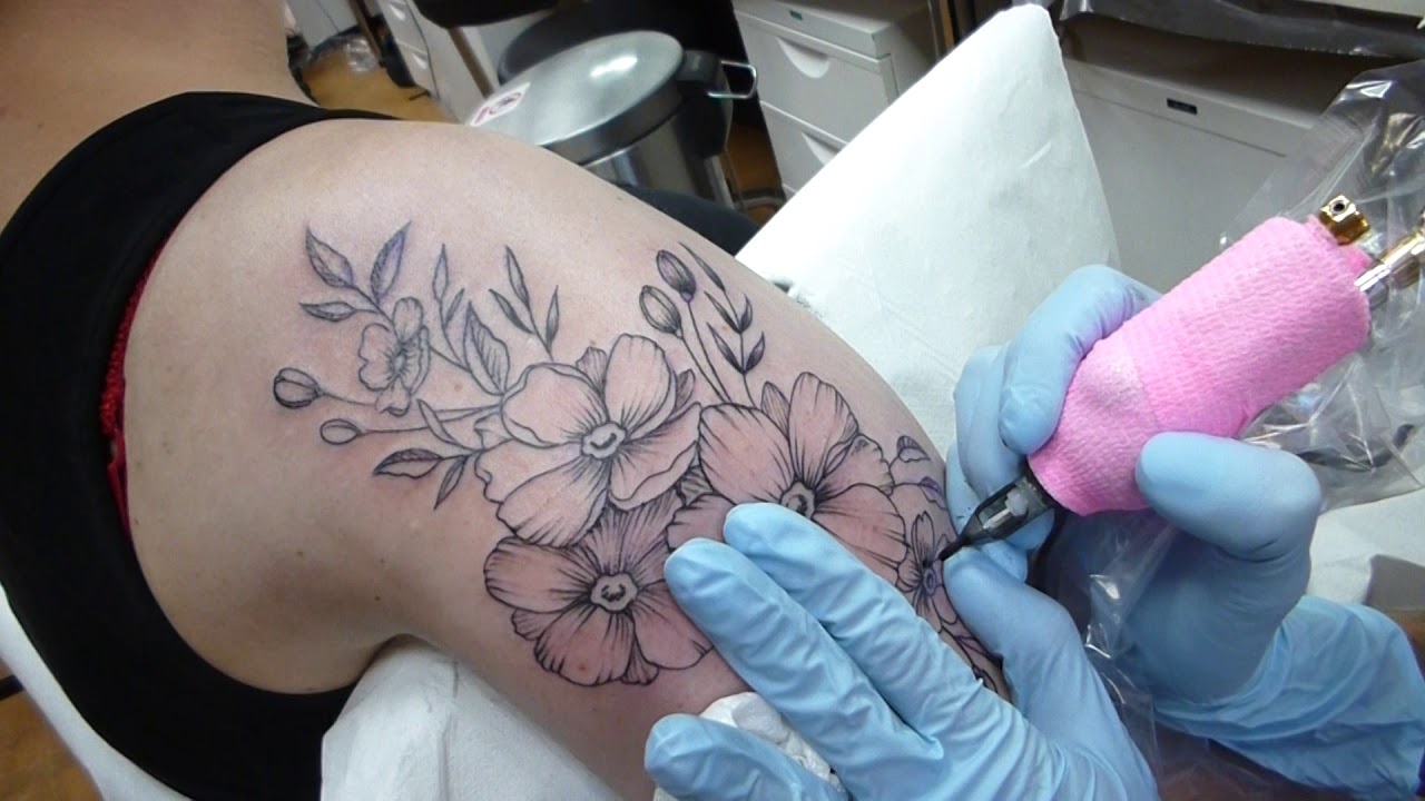 flower tattoo upper arm