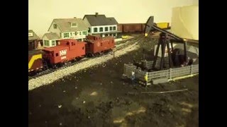 HO Scale Lufkin (TM) Oil Pump and Passing Train