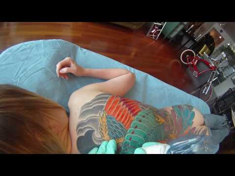 Adam Sky tattooing a phoenix PT01