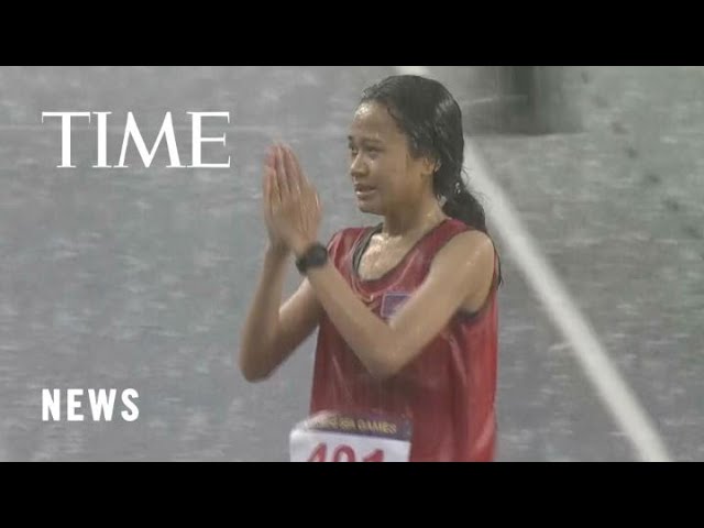 Hitting the squall: Cambodian runner refuses to quit race despite