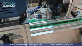 Automatic tax stamp labeling machine
