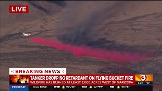 Tanker dropping retardant on Flying Bucket Fire burning west of Maricopa