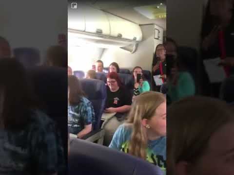 Choir Singing Hallelujah On Plane To New York