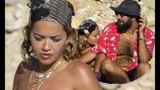  Rita Ora goes topless as she flaunts her toned curves and cosies up to beau Romain Gavras on the