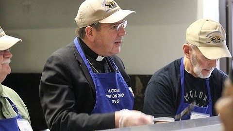 Detroit Archbishop Allen H. Vigneron provides  Christmas cheer to the poor