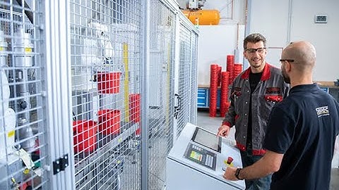 Automated filling line for buckets with SysTec weighing electronics