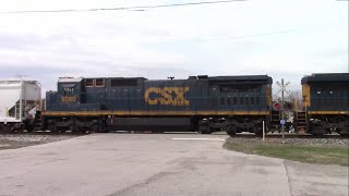 CSX M642 w/ CSX 7035 and CSX 9280 (C40-8) at Main Street in Chalmers, Indiana