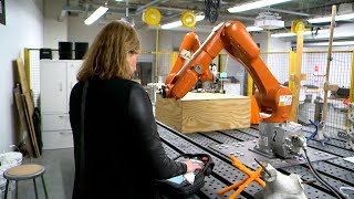 person using robotic arms