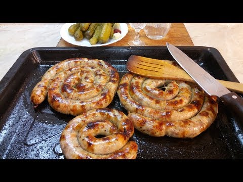 Homemade sausage. Homemade pork sausage. Ukrainian sausage with bacon and garlic. Moonshine.
