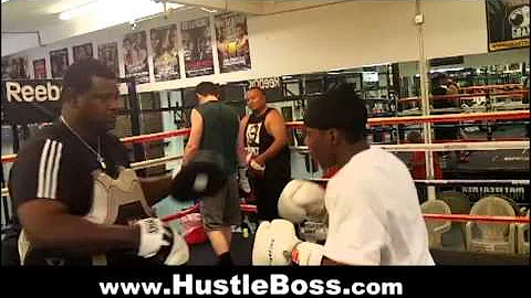 Prospect Derrick Wilson on the mitts with trainer ...