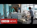 Hospitals approach “critical point” as millions wait for routine treatment - BBC News