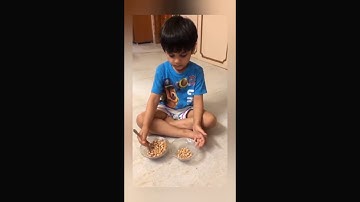 Vivaan transferring beans with spoon