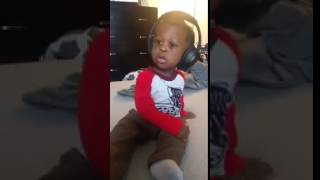 Toddler surprised by headphone music