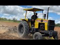 Trator cbt 8060 terminando o 2ª corte com grade niveladora para o plantio do capim