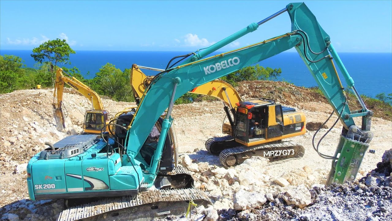 Excavators Digging Pond On The Ocean Cliff Komatsu PC200 CAT 320D ...