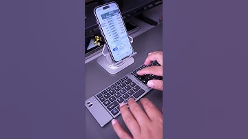 Perfect for business trips—this foldable keyboard transforms your phone or tablet into workstation