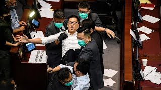 Two prominent hong kong opposition lawmakers were among more than a
dozen people arrested on wednesday in police operation focused last
year's huge prot...