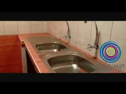 Cocina con muble de concreto y enchapado con ceramicos y con ...