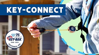 KEY-BAK Key-Connect 24" Kids Clear Retractable Keychain with Dual Carabiners and Orange Cord