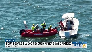 PHOTOS: Four boaters and dog rescued after boat capsizes near Oak Island