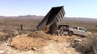 Hauling spoils from the pond to the top of the road @Timeline Ranch far west Texas homestead