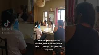 conducting Theory class on benefits and contraindications of massage therapy in our daily lives.