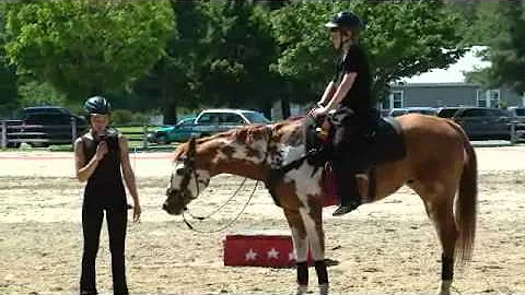 Kirsten Willey demonstrates trick riding