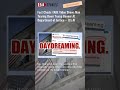 Fact Check: FAKE Video Shows Man Tearing Down Trump Banner At Department of Justice -- It's AI