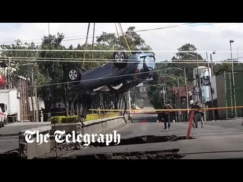 Sinkhole swallows car with passengers inside in Guatemala