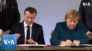 German chancellor angela merkel and french president emmanuel macron
signed a friendship treaty on tuesday that recalls historic pact the
former enemies ag...